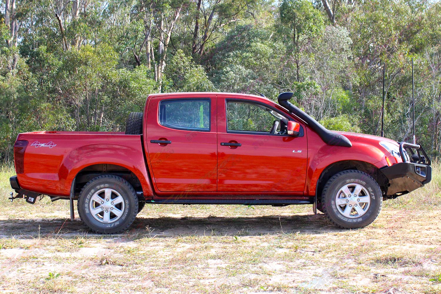 Right side view of a Isuzu D-Max dual cab fitted with a Bullbar, side steps, towbar, snorkel, uhf radio and lightbar