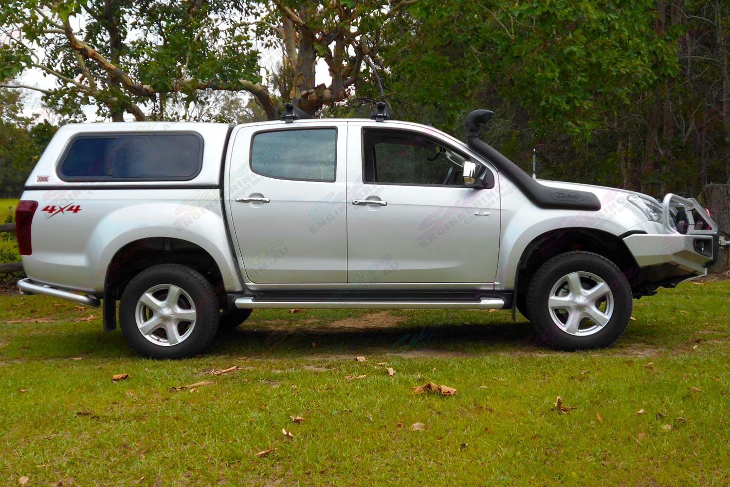 Right side view of a silver Isuzu D-Max dual cab fitted with a 2 inch superior nitro gas lift kit
