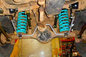 Full closeup view of some Superior Coil Springs, lower control arms, upper control arms, sway bar extensions and swaybar fitted to the rear of a GQ Nissan Patrol SWB 4WD
