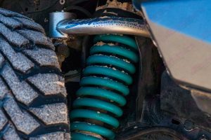 Closeup view of the Superior Engineering Upper control arm and coil spring fitted to the 200 Series Toyota Landcruiser 4wd
