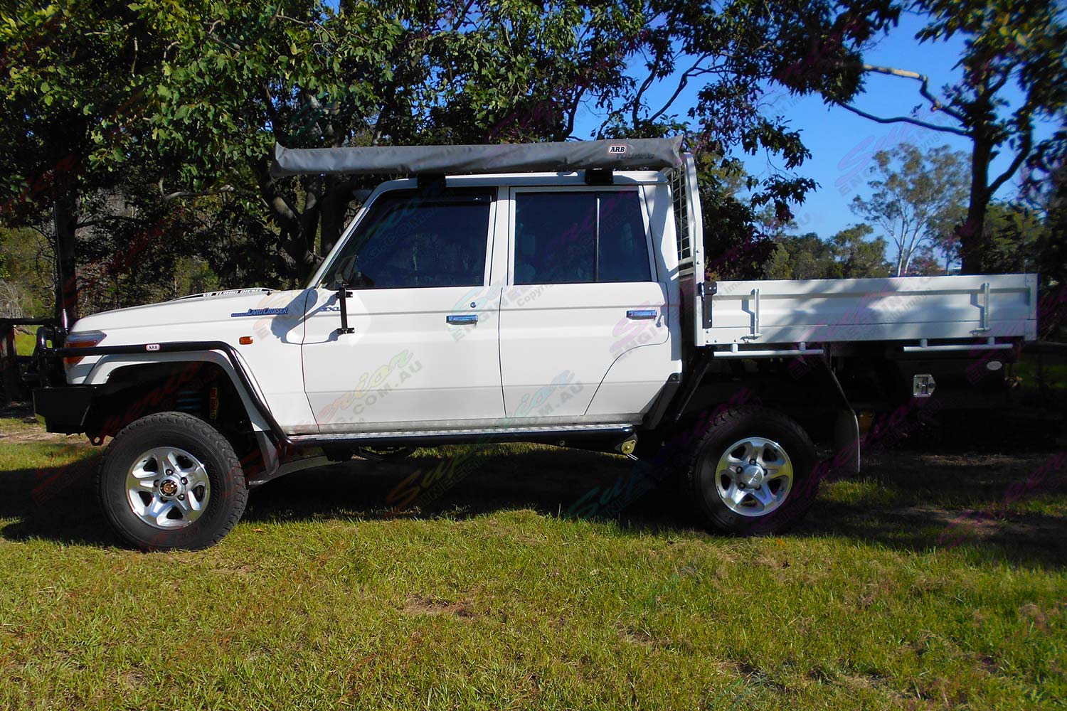 Left side view of a 79 Series Toyota Landcruiser dual cab fitted with a heavy duty Superior 4 Inch Dropped Radius Arm Lift Kit
