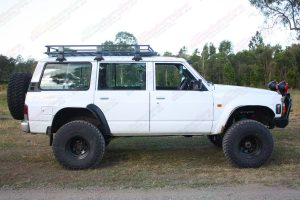 Right side view of a white GQ Nissan Patrol wagon after being fitted with a Superior Remote Reservoir Superflex 5 Inch Lift Kit