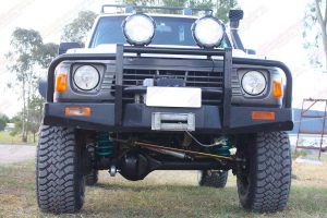 Full front view of a GQ Nissan Patrol wagon after being fitted with a Superior and Profender Remote Reservoir Superflex 5 Inch Lift Kit