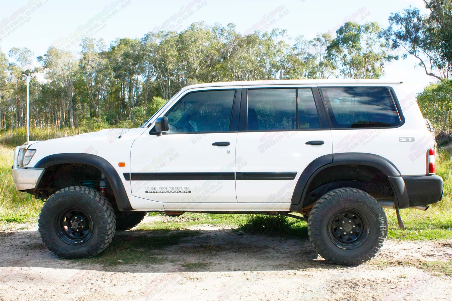 Left side view of a white GU Nissan Patrol wagon after being fitted with a 5 inch EFS Extreme lift kit