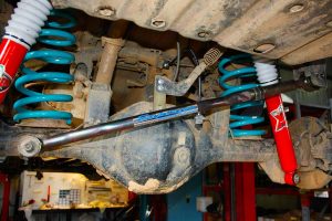 Under vehicle view of a pair of EFS Extreme shocks, EFS coil springs and Superior panhard rod fitted to the rear of a GU Nissan Patrol