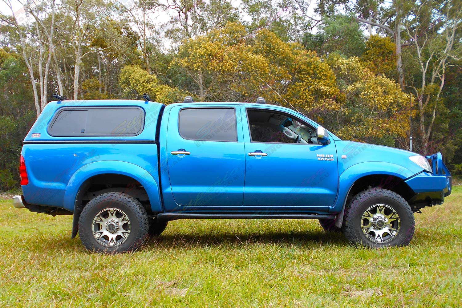Right side view of a blue dual cab Toyota Hilux (Vigo) fitted with a top of the range 3 inch Bilstein lift kit