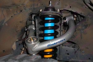 Closeup view of a Superior upper control arm, coil spring and Bilstein shock fitted to a Toyota Hilux (Vigo) dual cab