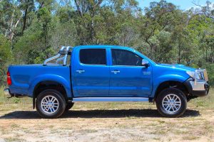 Right side view of a blue dual cab Toyota Hilux (Vigo) fitted with a premium 3 inch Bilstein lift kit