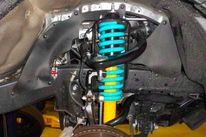 Closeup view of a Dobinson coil spring and Dobinson strut fitted to a Toyota Hilux Dual Cab