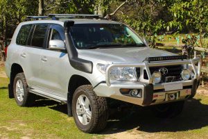 Front right view of a silver 200 Series Toyota Landcruiser after being fitted with a heavy duty 2 inch Profender 4x4 lift kit