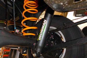 Closeup view of the Ironman foam cell pro shock and coil spring fitted to the underside of the NP300