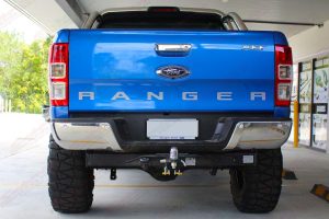 Rear end view of the Ford Ranger (PX11) after being fitted with a 5" inch lift kit at the front of the Superior 4x4 retail showroom
