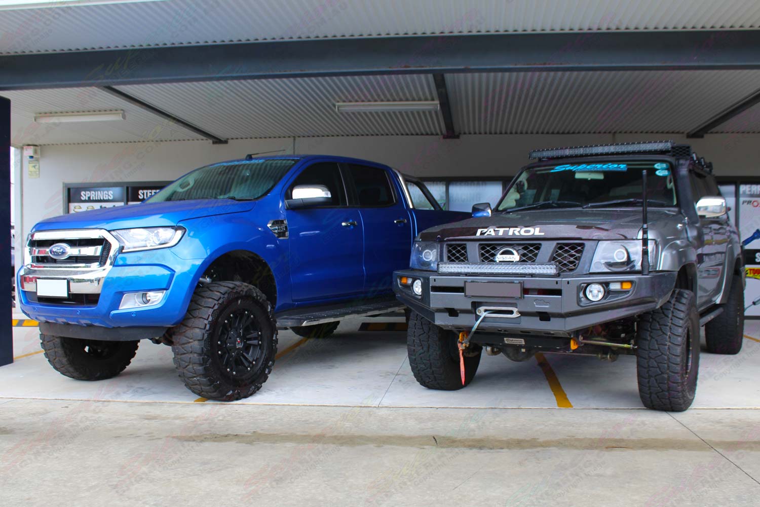 A 4 inch lifted Nissan Patrol next to the 5 inch lifted Ford Ranger at the ...