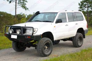 Front left view of a white 105 Series Toyota Landcruiser Wagon after being fitted with a 3 inch superflex lift kit featuring Tough Dog shocks
