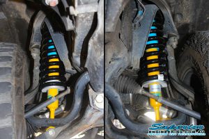Closeup under vehicle view of some Bilstein struts and EFS coils fitted to the PX Ford Ranger 4WD