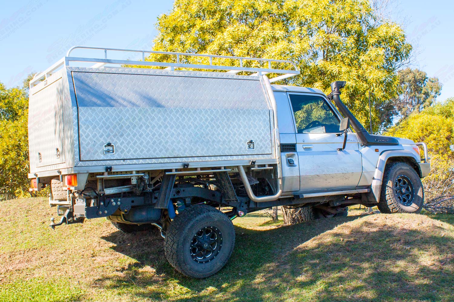 Right side view of a Silver 79 Series Single Cab Toyota Landcruiser at the Superior Engineering workshop fitted out with a new rear coil conversion kit, front suspension and airbag kit