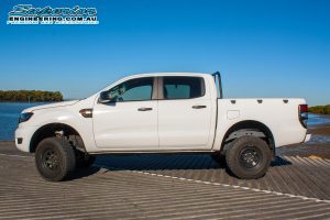 Left side view of a white Ford Ranger PX after being fitted with a 3 inch Superior Nitro Gas lift kit at the Superior Engineering Burpengary workshop