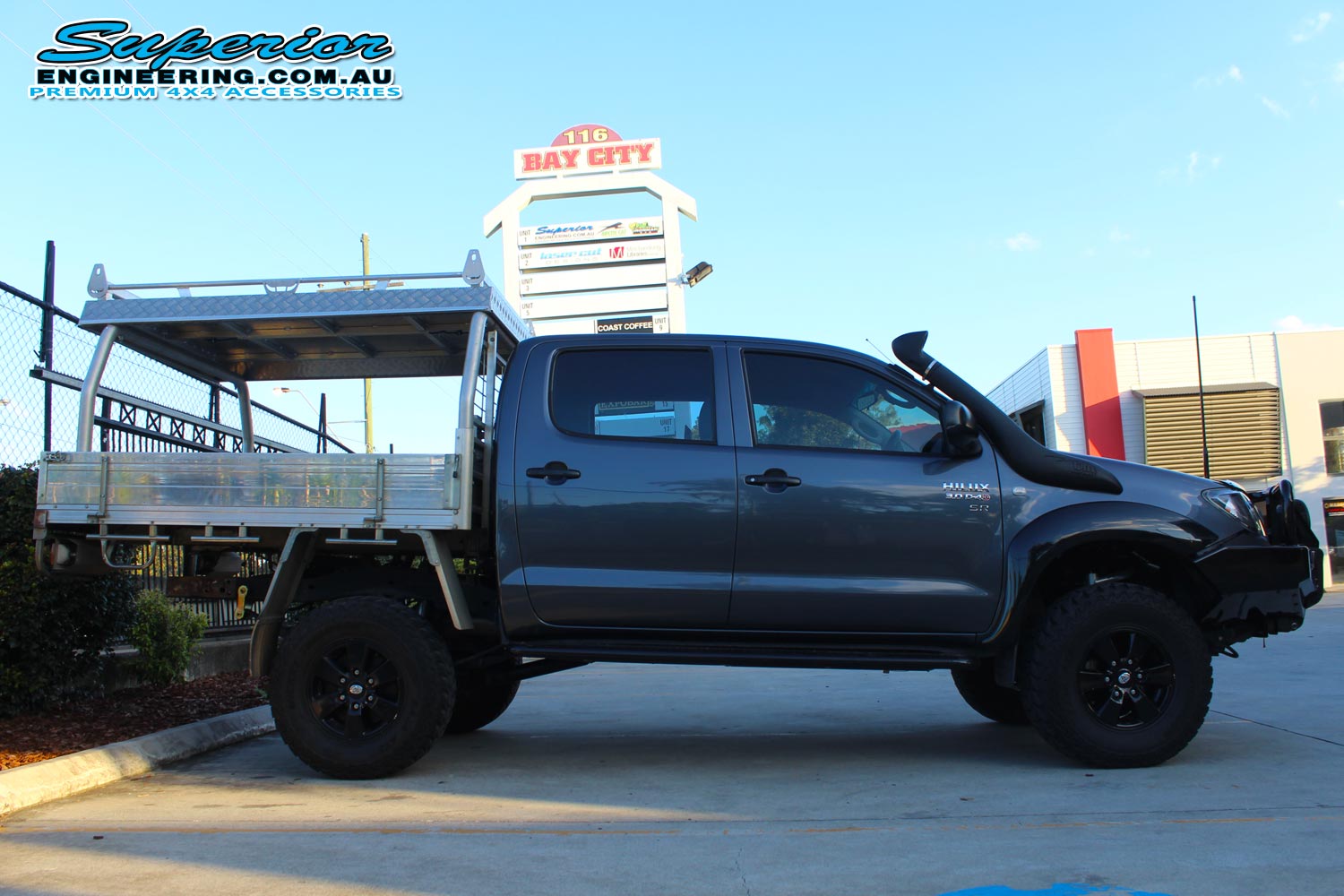 Right side view of a dual cab Toyota Hilux fitted with a complete range of 4x4 accessories and 3 inch lift kit