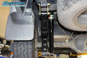 Closeup view of a single EFS shock absorber, leaf springs and shackles fitted to the rear of the Isuzu D-Max 4wd