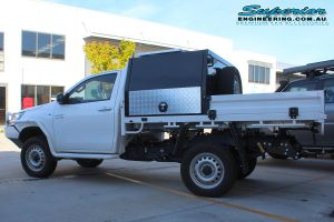 Left side view of a single cab Toyota Hilux Revo fitted with a 2 inch Bilstein lift kit, Dual air control kit and Airbag Man leaf spring helper kit