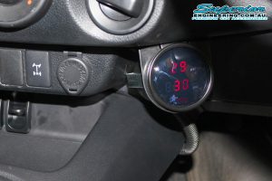 Closeup view of the Airbag Man digital dual air control gauge fitted to the dashboard in the Toyota Hilux Revo