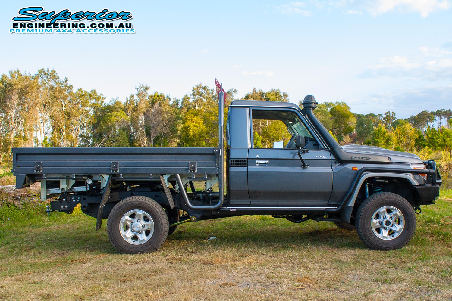 Right side view of a 79 Series Toyota Landcruiser fitted out with a full rear coil conversion kit and rear track width correction system