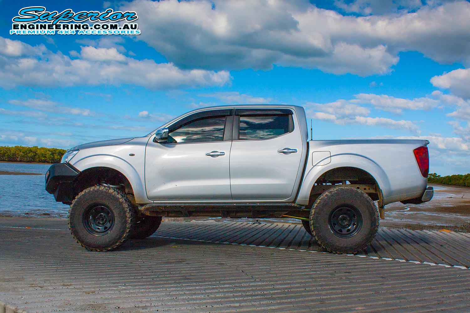 Left side view of an NP300 Nissan Navara (dual cab) after fitting a suspension kit by Superior Engineering