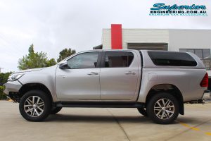 Left side view of a Silver Toyota Hilux Revo (dual cab) after being fitted with a top of the range 2 inch Bilstein lift kit at the Superior Engineering Deception Bay 4WD Workshop