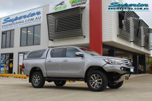 Right side view of the Silver Toyota Hilux Revo (dual cab) after being fitted with a 2 inch Bilstein lift kit at the Superior Engineering Deception Bay 4WD Fitting Workshop