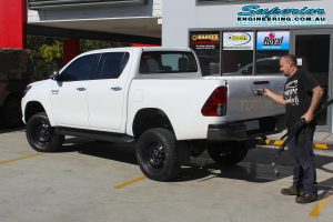 Rear left view of the white dual cab Toyota Hilux Revo fitted with a complete 3 inch Superior Nitro Gas lift kit at the Deception Bay 4x4 fitting workshop
