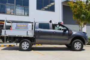 Right side view of a grey Dual Cab PX Ford Ranger fitted with a heavy duty 40mm Tough Dog lift kit at the Superior Engineering Deception Bay 4x4 store