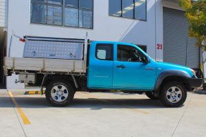 Right side view of a blue Mazda BT-50 extra cab fitted with a premium 35mm Bilstein lift kit from Superior Engineering