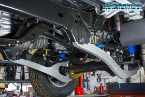 Closeup underside view of a set of Superior Superflex Radius Arms fitted to the front of the 79 Series Toyota Landcruiser Dual Cab