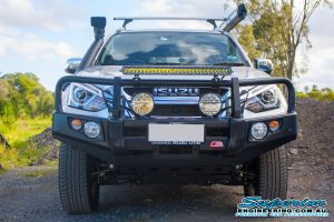 Front view of a silver Isuzu MU-X wagon fitted with a range of Lightforce, Ironman, MCC4x4, TJM 4x4 accessories and a heavy duty 45mm EFS lift kit