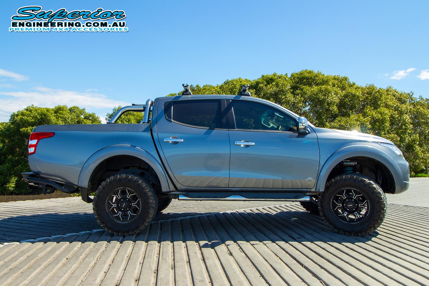 Right view of a MQ Mitsubishi Triton fitted with some Premium Superior Remote Reservoir Shocks and Struts at the Caboolture river boat ramp