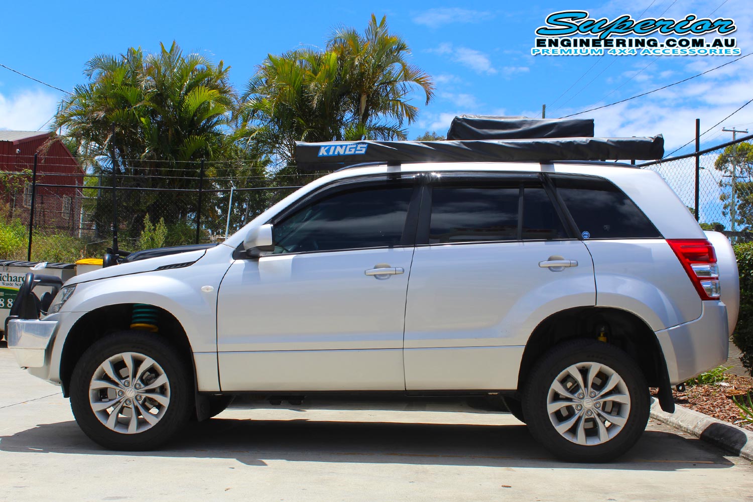 Left side view of a silver suzuki grand vitara wagon fitted with a 40mm Dobinson lift kit at the Superior 4x4 retail showroom