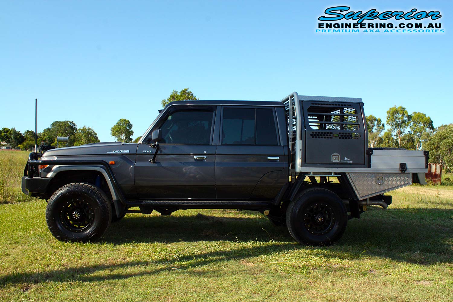 Left side view of a dual cab 79 Series Toyota Landcruiser after fitting the 2 inch Superior Nitro Gas Lift Kit + Allied Wheels