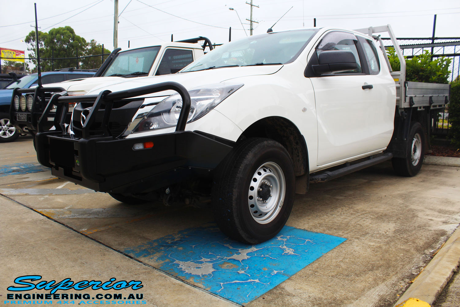 Front right view of a Mazda BT50 Freestyle Cab after fitting of a Black Ironman 4x4 Commercial Bullbar
