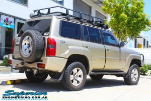 Back right view of a Gold Nissan GU Patrol Wagon after fitting a 2" inch lift with Dobinsons Coil Springs & Fox Shocks Kit