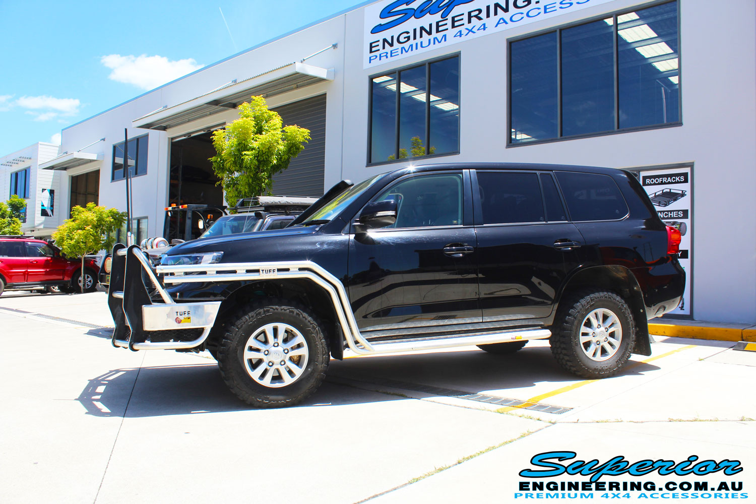 Left side view of a Toyota Landcruiser 200 Series before fitting the Superior OE 2.5 Remote Reservoir 2 Inch Lift Kit