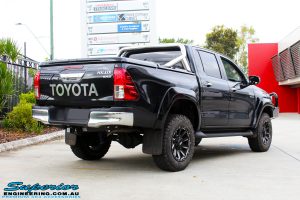 Right rear view of a Black Toyota Hilux Revo before fitting a 2" inch lift with Superior Remote Reservoir Rear Shock & Front Strut and Coil & Leaf Springs