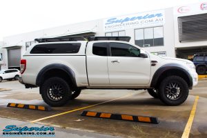 Right side view of a White Ford PXII Ranger after fitment of the Superior Diff Drop Kit