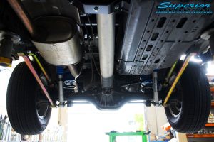 Rear underbody view of fitted Superior Nitro Gas Shocks + Coil Springs with Airbag Man Coil Air Kit Helper and Lower & Upper Control Arms