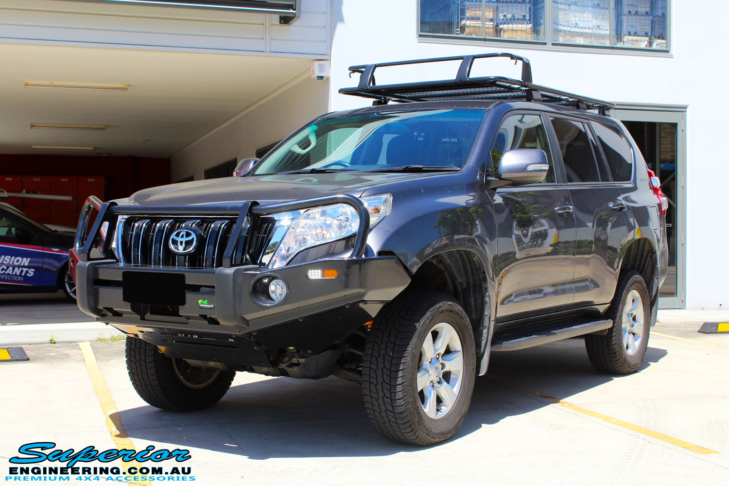 Left front side view of a Grey Toyota 150 Series Landcruiser Prado after fitment of a Superior Nitro Gas 2" Lift