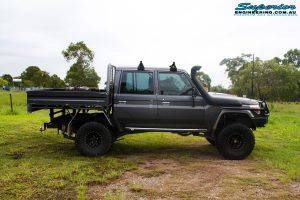 Right side view of a Grey Toyota 79 Series Landcruiser Dual Cab before fitment of a Superior 4" Inch Rear Coil Conversion Kit with Hyperflex Radius Arms, Remote Reservoir Shocks and a Airbag Man 4" Inch Coil Helper Air Kit.