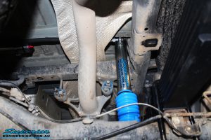 Right rear underbody view of a fitted Superior Remote Reservoir Shock with Leaf Spring
