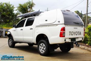 Rear left view of a Toyota Vigo Hilux Dual Cab after fitment of a Superior Remote Reservoir 2" Inch Lift Kit, Ironman 4x4 Bullbar, Steel Side Steps, Snorkel & Engine Diff Guard with Rated Recovery Point