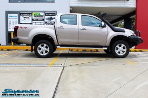Right side view of a Silver Isuzu D-Max Dual Cab after fitment of a Superior Nitro Gas 2" Inch Lift Kit + MCC Rocker Bull Bar + Rear Bar & a Superior Diff Drop Kit