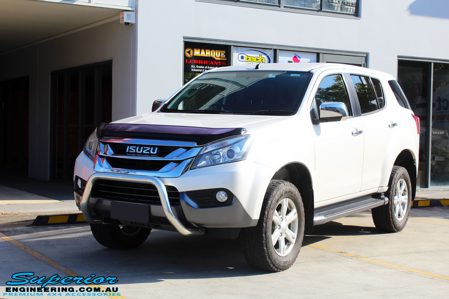 Left front side view of a White Isuzu MU-X Wagon after fitment of a quality Bilstein 45mm Lift Kit