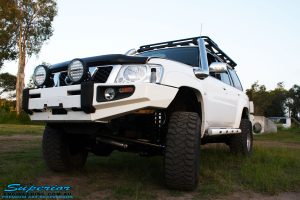 Front left side view of a White Nissan GU Patrol Wagon after fitment of a range of high quality Superior Engineering 4x4 Suspension & Accessories